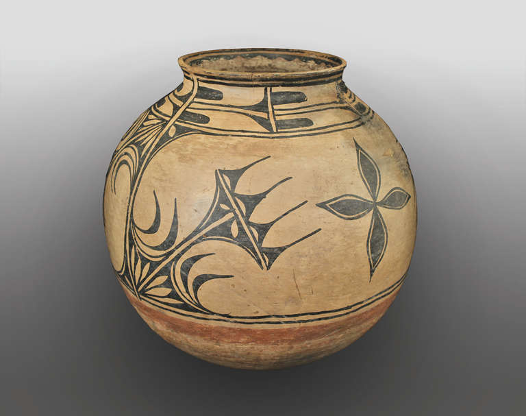 A large storage jar constructed of earthenware and finely painted with slip glazes in traditional Native designs.

Complimentary shipping within the United States. Contact us for a quote on international shipping. Expedited shipping is
