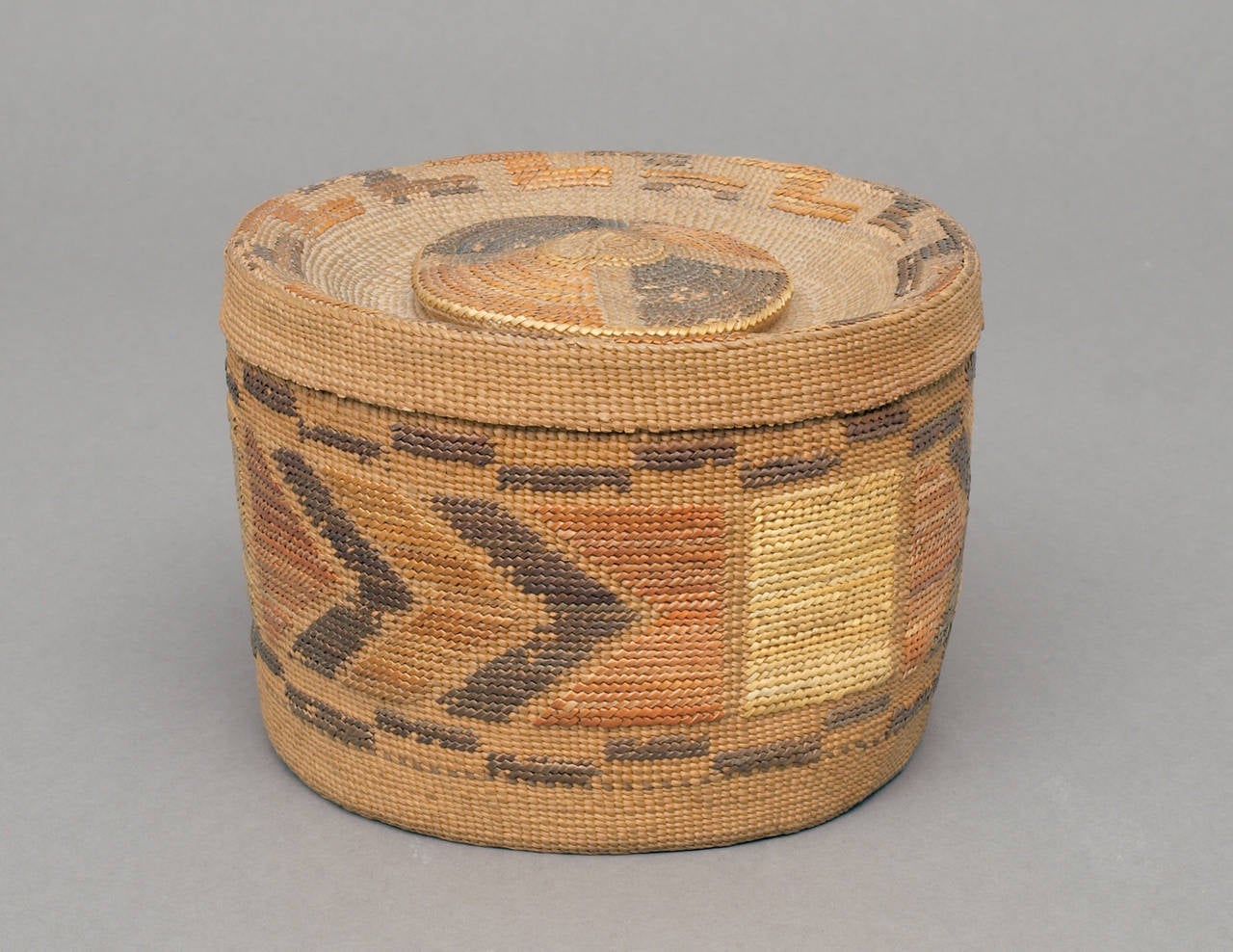 A combination of Spruce Root fibers and native grasses intricately twined by a Tlingit woman around 1920.   Rattle Top baskets such as this were extremely labor-intensive to create and it is estimated that around 300 hours went in to the creation of