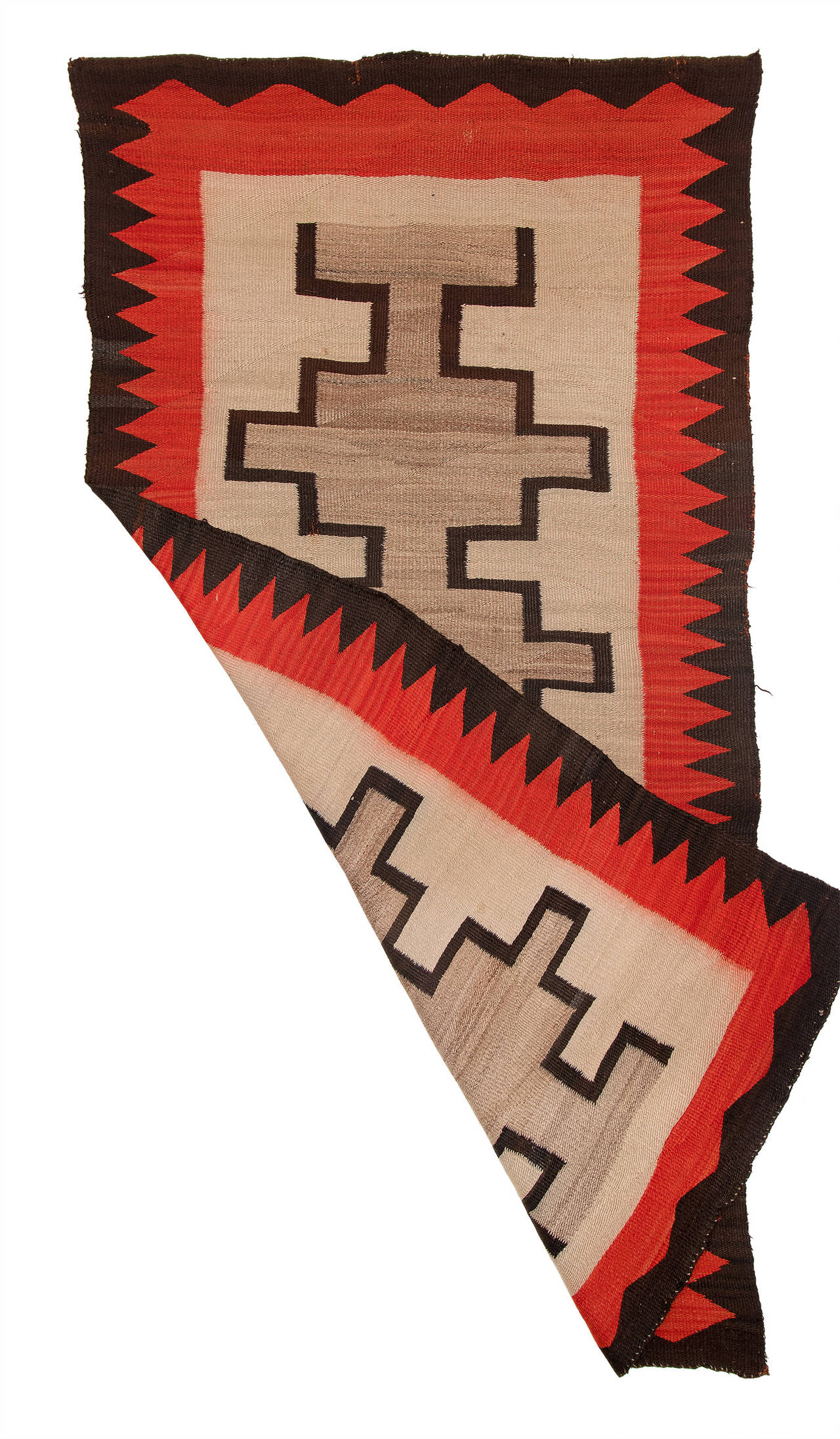 A vintage trading post rug/floor runner woven of native handspun wool in natural ivory, gray and brown fleece with aniline dyed red. Most likely from the Ganado Trading Post (founded by John Lorenzo Hubbell at Ganado, Arizona, in 1876).

This