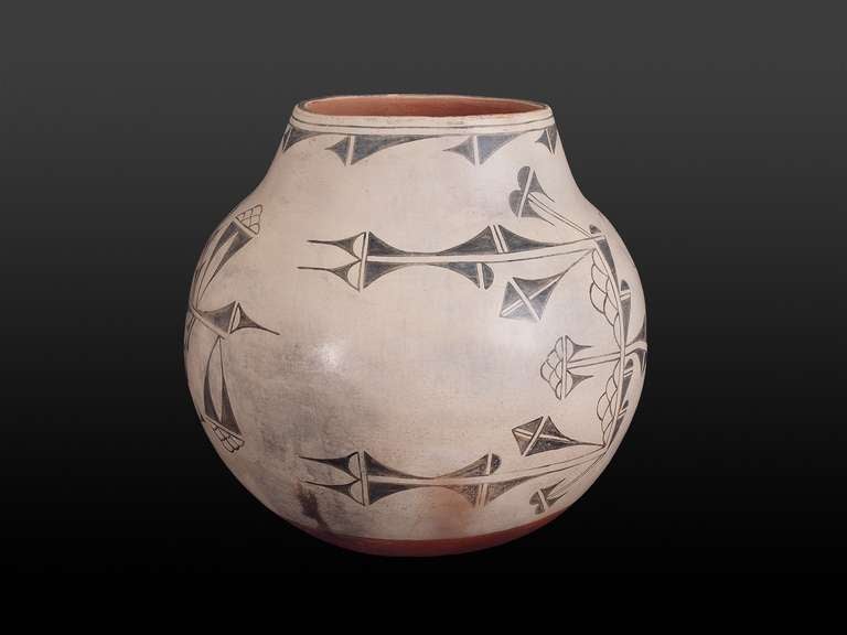 A large Native American Jar exquisitely painted with slip glazes on earthenware.  Created at Cochiti Pueblo in New Mexico.