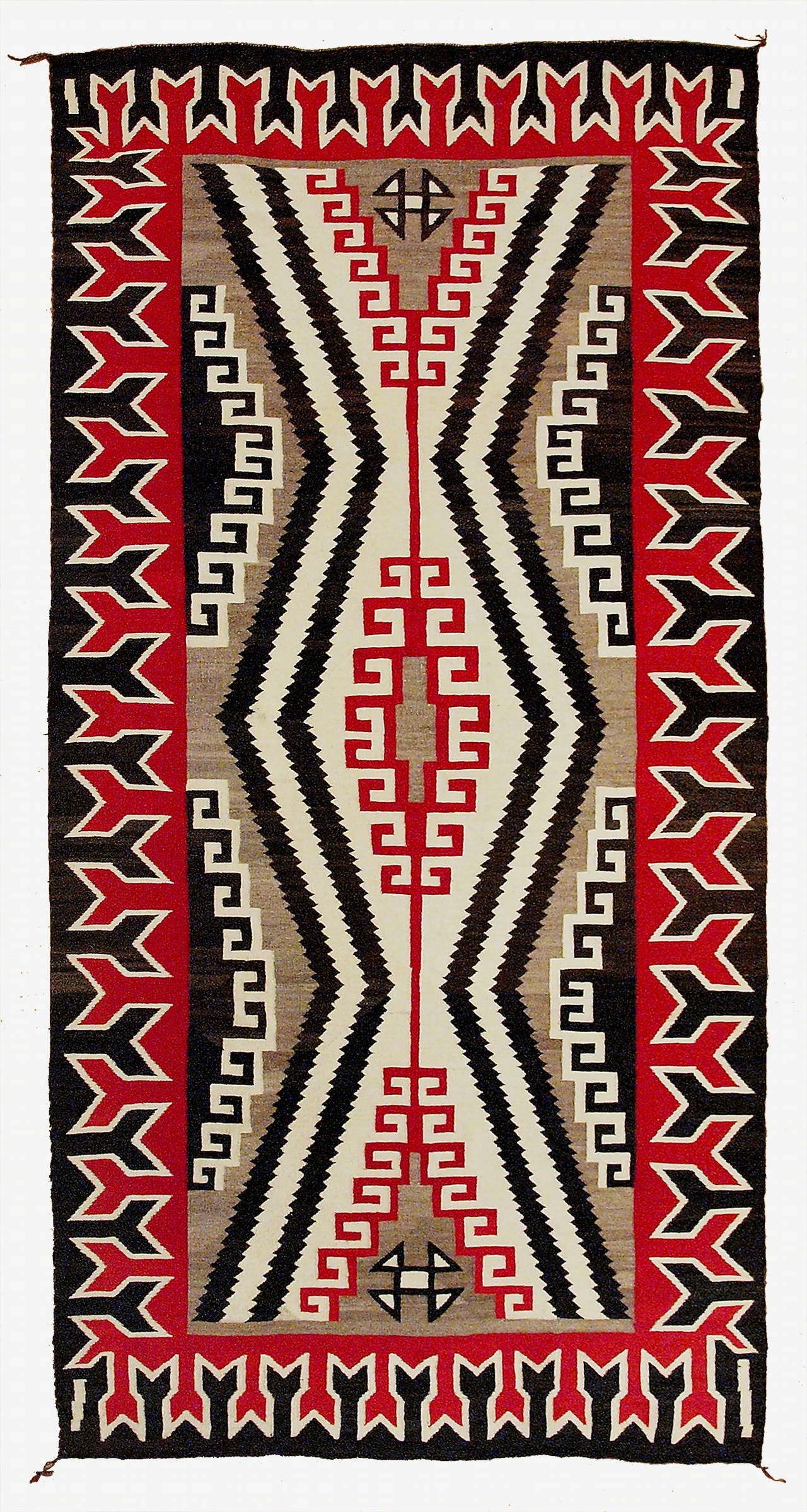 A Pan reservation or regional rug woven of native hand-spun wool with natural ivory, black and gray fleece with aniline red.  The border consists of a stylized Buffalo track motif.

This textile is well suited for display as a wall hanging or as