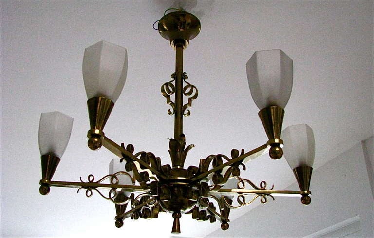 1940 French Art Deco modernist bronze chandelier. Original French Art Deco chandelier from the 1940s. Original frosted glass shades. Original, unrestored condition of the brass and brass-plated bronze parts. Very heavy. Rewired.

Measures: Height