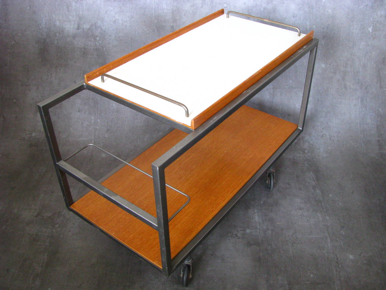 1960s midcentury serving table bar by Georges Frydman, iron frame, separate trayer with formica surface, wooden details restored, French polished, castors in good vintage condition.

Dimensions: 
Width: 17 in (43 cm).
Length: 33.9 in (86