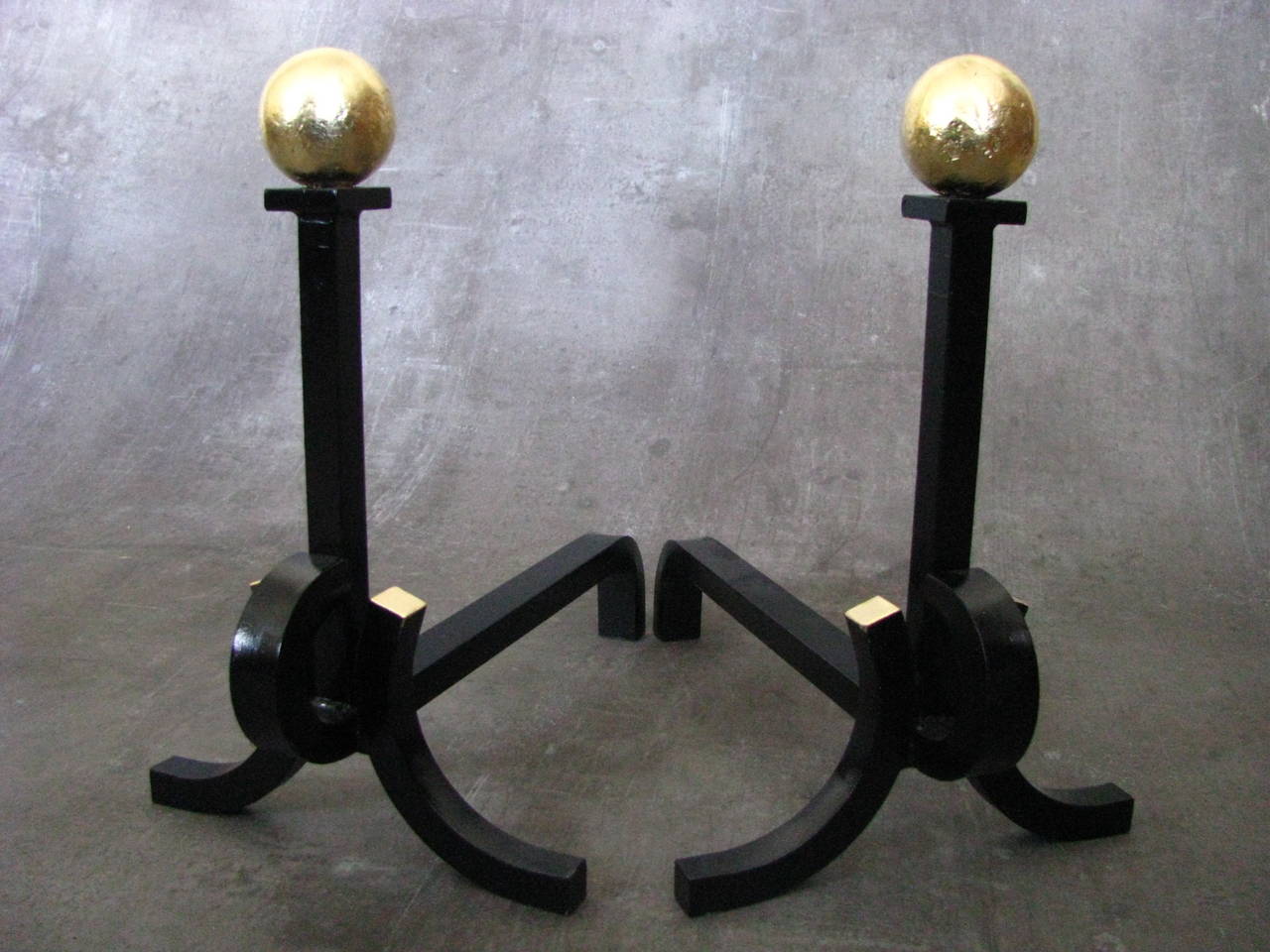 Art Deco French Andirons from 1930 in the manner of Subes.

Original French andirons, wrought iron, goldleaf detailing. 

Note: reminds of the works from Raymond Subes!

Length 40 cm ( 15,8 in).
Height 41 cm ( 16,2 in).
Width 25 cm ( 9,9