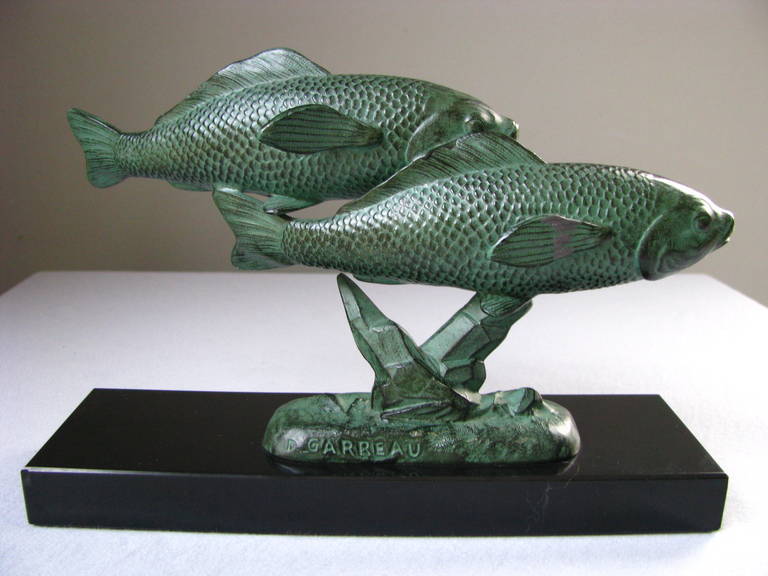Art Deco Sculpture Of Two Fish (trouts) By famous art deco sculpturer Georges Garreau, france 1940s. Signed. perfect vintage condition. bronze patinated regule on black marble base.

measurements:

Height:     5.9     in.     ( 15 cm)
Length:  