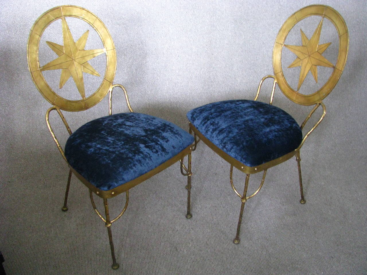 Set of six dining room chairs in wrought iron with a gold leaf patina.
France, circa 1940. Newly upholstered with a high quality Atlantic blue velvet!
Probably a work of one of French art deco iron artists René Prou or René