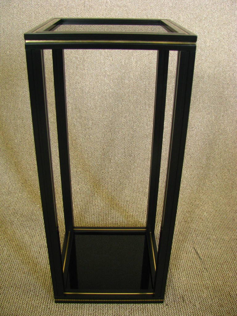 Midcentury Side Table Pedestal by Pierre Vandel, Paris

1980's Pierre Vandel, Paris. Black laquered Aluminium with gold tint foil stripes, two glass shelves. Signed on top.

Width:    11,8 in ( 30 cm)
 Length: 11,8 in ( 30 cm)
 Height: 27,6 