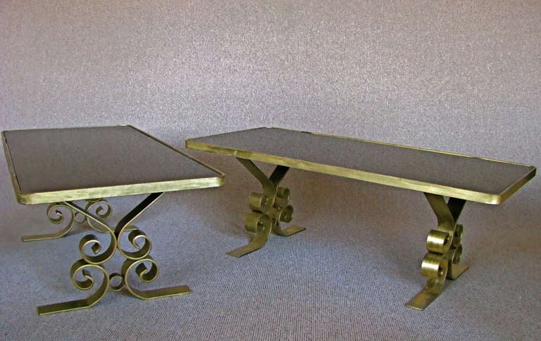 Pair of large Art Deco side/end Tables, France around 1940. Dim gold lacquer surface. Glass tops black.

height:  18 in  (45cm)
width: 23 in   (58cm)
length: 48  in   (122cm)

Note: Representative of the rare 1940th furniture!

We offer