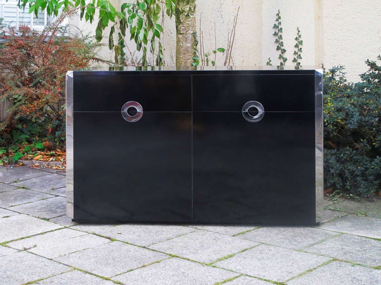 Black laminate and chrome steel sideboard designed by Willy Rizzo and produced by Mario Sabot, Italy 1972.
Two drawers and shelving.
Edition limited to approximately 2000.