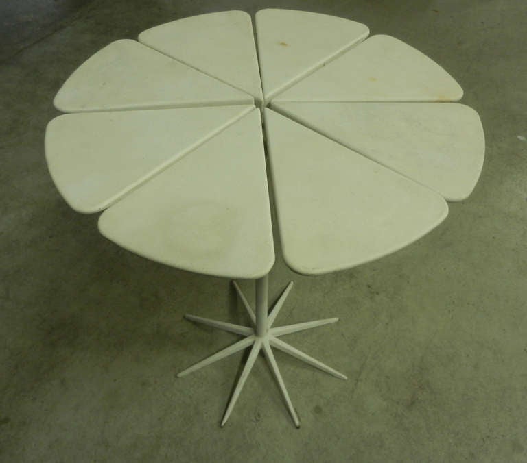 the petals of this table are made of ceramic ! the serial production petals are made of wood. natural or painted white. purchased from an former knoll employee.....