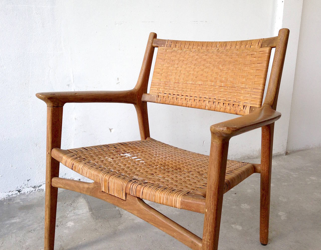 Hans J. Wegner

a fantastic lounge chair from Hans J. Wegner - made by Johannes Hansen, Copenhagen. Designed in 1951.

condition: the chair is in fair conditions. The frame is strong, cane has defects and the wood needs some love... for