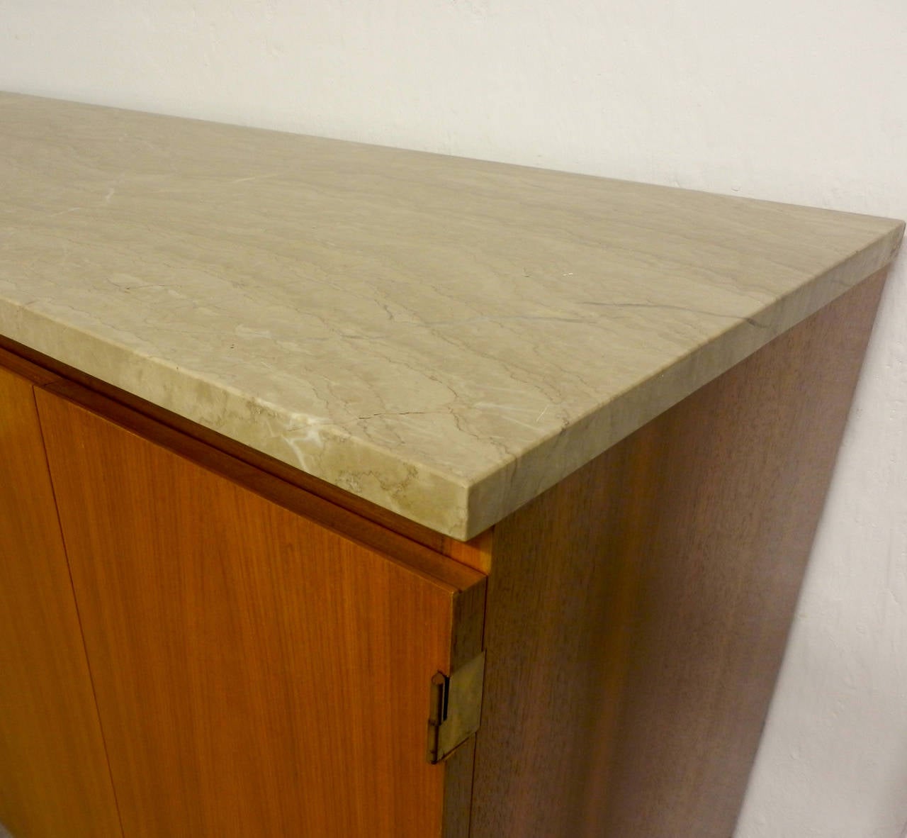 Designed in 1960 and made by wk. Beautiful walnut case and legs. Polished stone top in very good condition.