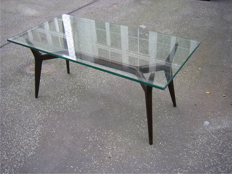 Attributed to Gio Ponti, massive wood base with original hand-cut and polished glass top.