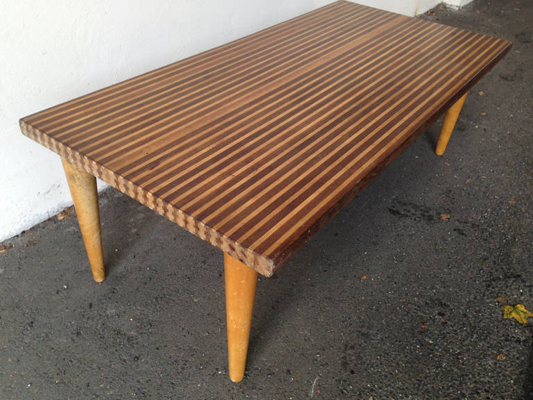 by Tove & Edward Kindt-Larsen . designed around 1950 and made by NK. massive wood stripes clued together to create a unique and amazing top .