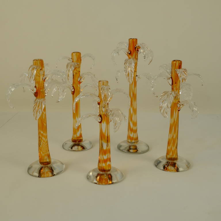 Set of five handblown glass Palm Tree Candleholders by Cenedese for Tiffany, NYC. Different Heights: 1 x 31,5cm, 3 x 27,5cm & 1 x 23cm and similar width of  about 15cm.