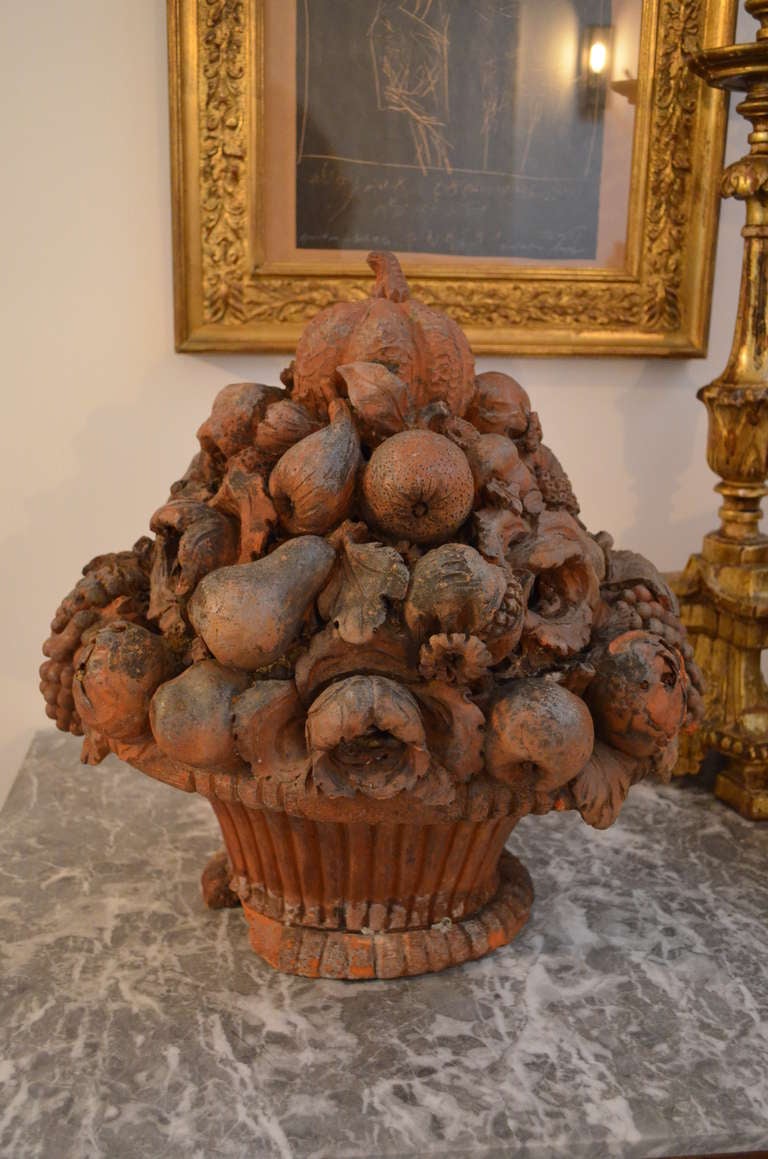 Pair of France 19th century terra cotta flower and fruit baskets,
the baskets are slightly damaged.