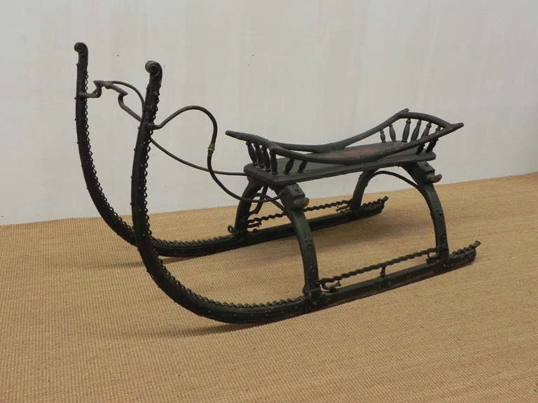 Antique, very nicely painted sleigh. In perfect condition with  
hand wrought iron.