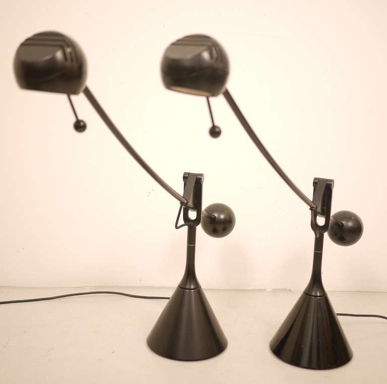 A pair of desk lamps designed by Erich Franch in 1974.  Manufactured by Metalarte.  Aluminum structure, painted in black.   Swinging arm and swivel head.Spanish design.

Hal. H3. 12 V.Max 55W
