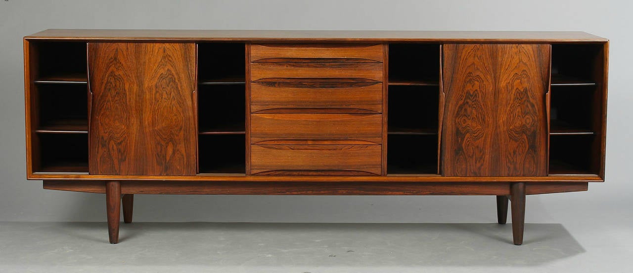 A Brazilian rosewood sideboard edited by Skouby Furniture in 1970. Front with five drawers and two sliding doors, inside with shelves.