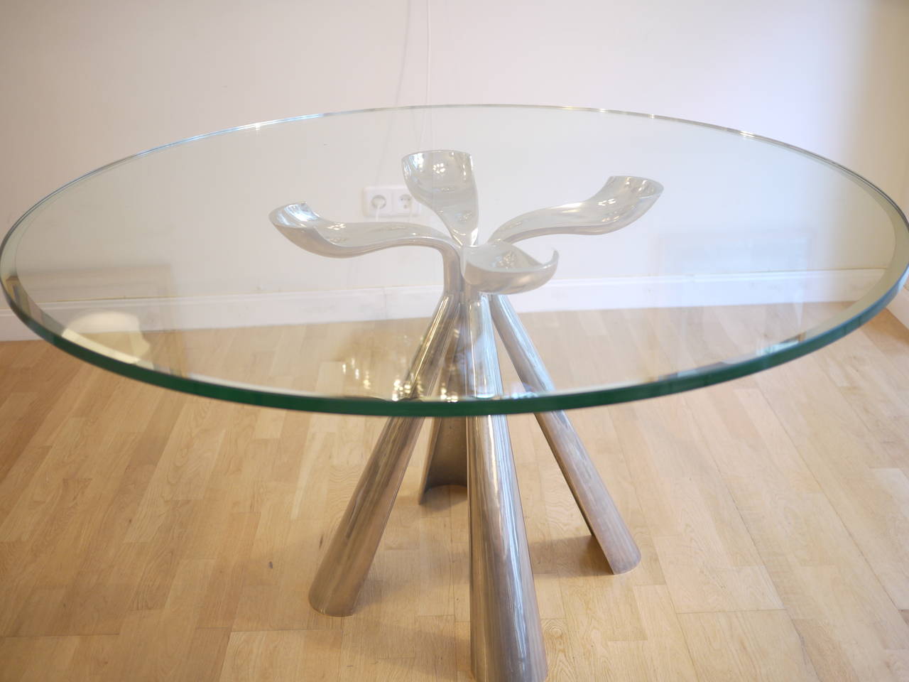 A  large dining table designed by Vittorio Introini for Saporiti in 1972.Cast aluminum glas on chromed  cast steel base.