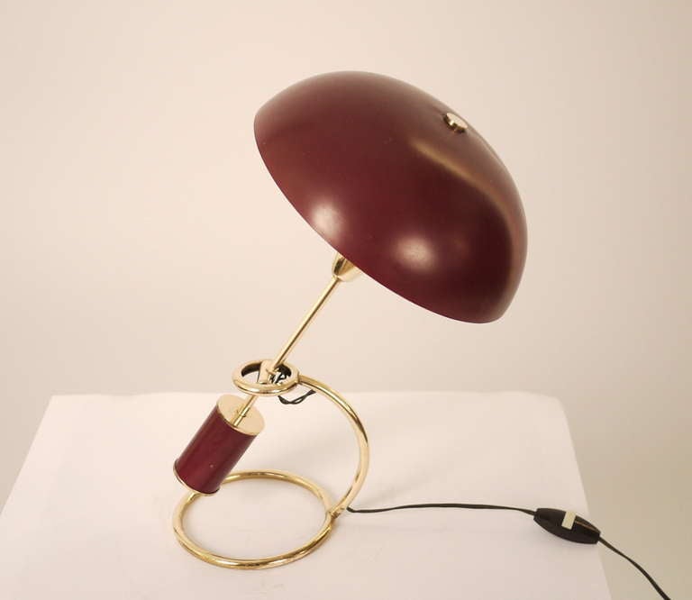 An Angelo Lelli table lamp for Arredoluce Monza .1953 .An adjustable table lamp which allows the standard and the shade  to adjust to any position.