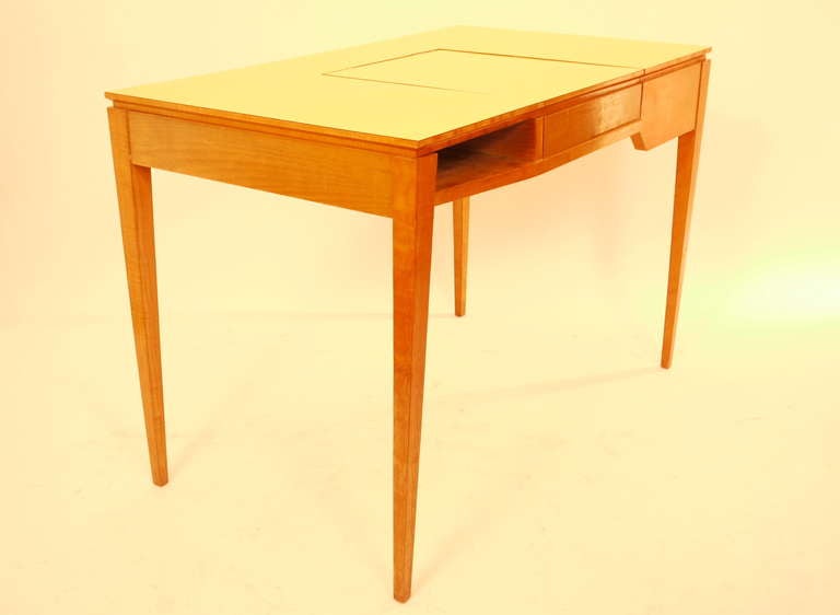 A vanity desk designed by Ico and Luisa Parisi in 1950. Edited by Fratelli Rizzi in 1950. Cherrywood frame and melamine board. Inside mirror. Provenance: Casa Rizzi, Autentica Roberta Lietti.
