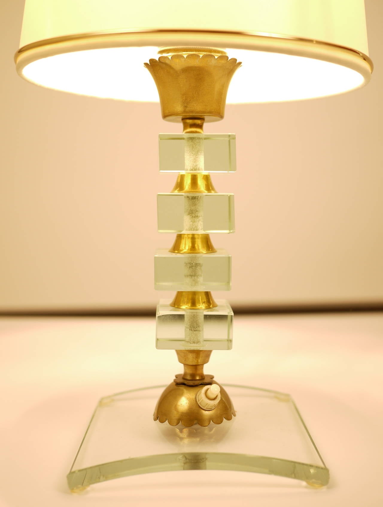 An Italian, 1959 table lamp in the style of Pietro Chiesa. Glass and brass.