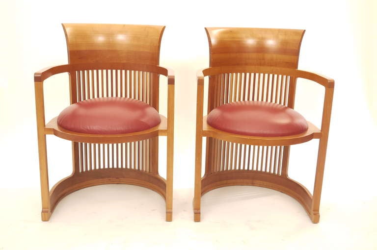 A pair of  Frank Lloyd Wright Barrel chairs ,designed in 1937 and edited by Cassina in 1986,Stamped , signed and numbered. Cherry frame and leather.