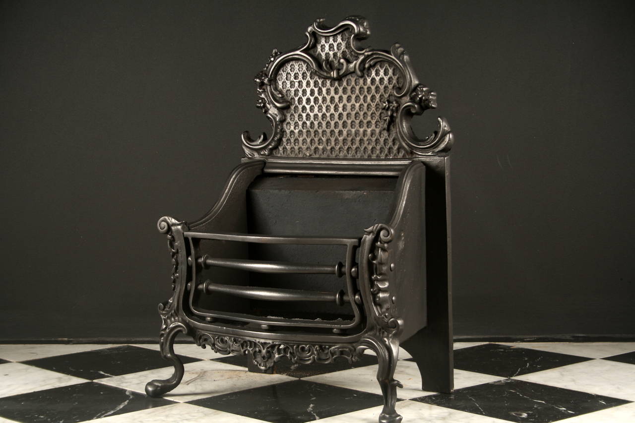 An Antique Cast Iron Rococo Manner Fire Basket

Depth: 13 3/4