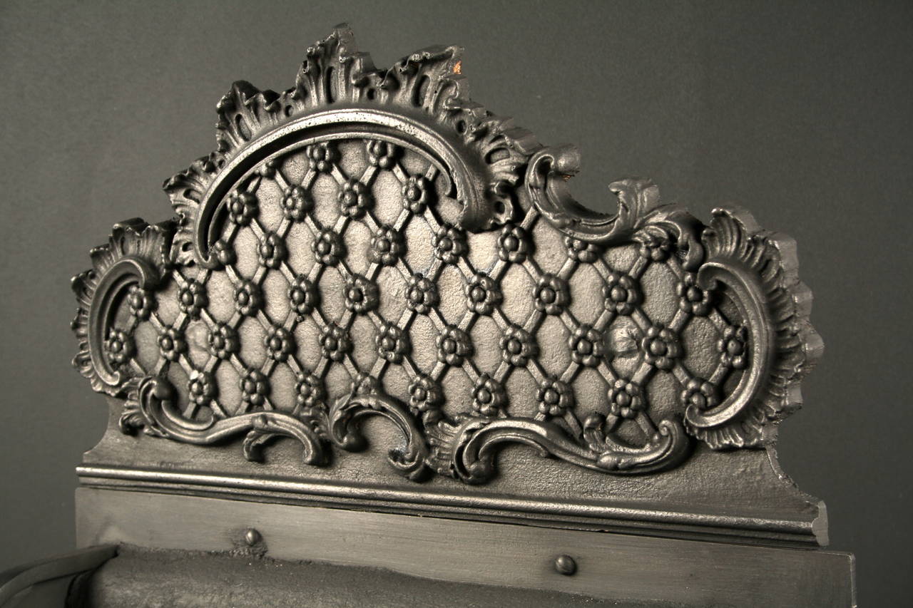 19th Century A Rococo Revival Brass and Cast Iron Fire Basket