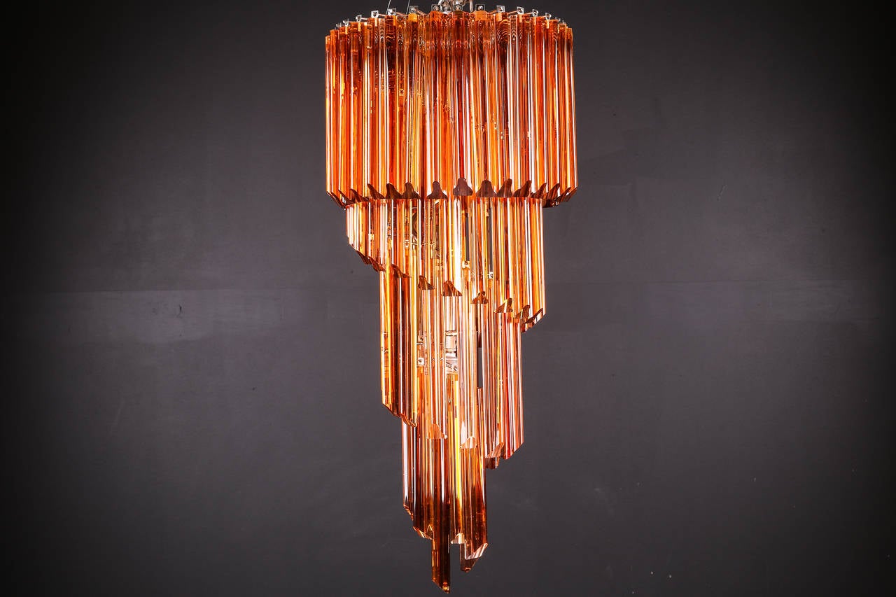 Beautiful spiral chandelier with amber tint Murano glass by Venini

Measure: Glass height only 32 1/2