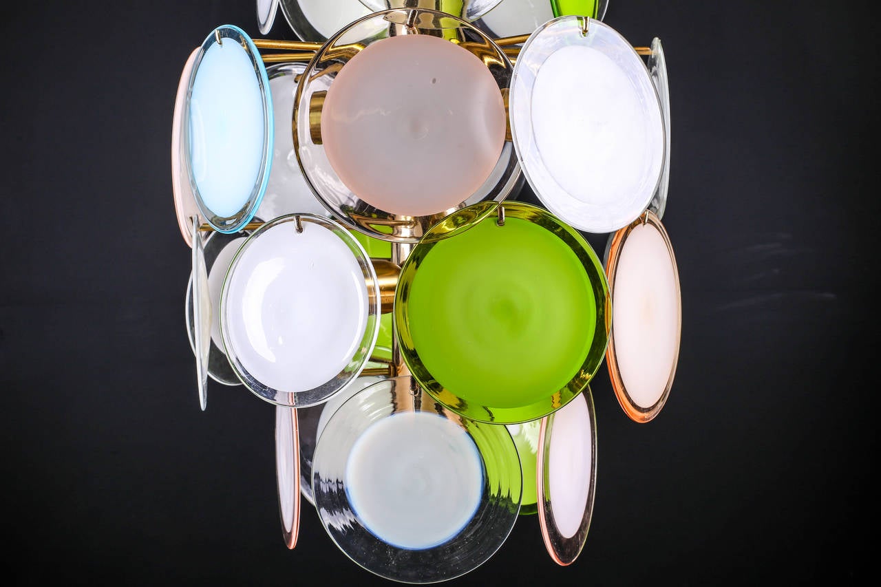 Large impressive multi-color Murano glass Vistosi disc chandelier, 1970s

Measures:
Total height 43
