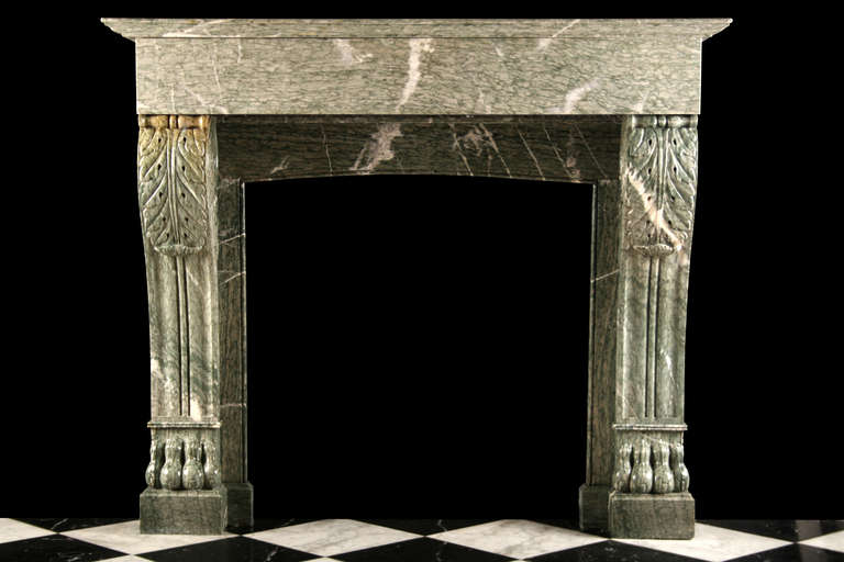 An Antique Louis XVI Fireplace Mantel finely carved in elegantly veined light green Campan marble, with richly carved Lion Paw feet, acanthus leaf scrolled tops and sided, French Circa 1850.

Depth: 15 1/4