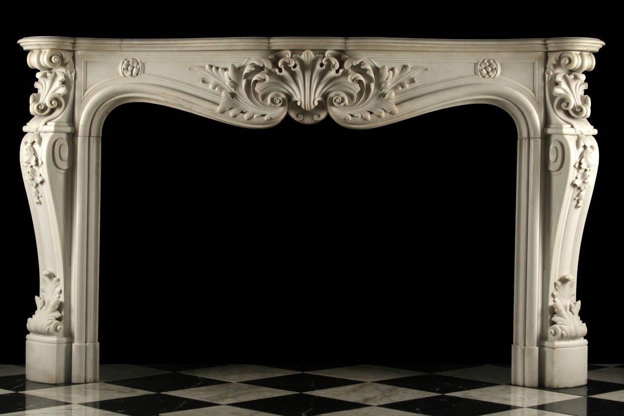 An very grand antique Louis XV White Statuary Marble fireplace Mantel in the manner of Rococo, with the serpentine shelf above the panelled frieze centred by a large shell & acanthus leaf cartouche, also with angled and scrolling panelled jambs, all