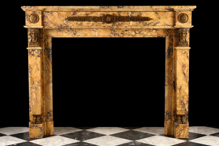 A very fine Neoclassical Sienna marble Antique Chimneypiece, with a rectangular shelf above a plain frieze with beautiful brass decoration, flanked by Brass Grecian terms on block feet, French circa 1850.

Depth: 14 1/4