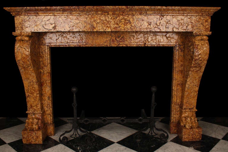 A well proportioned Antique Louis XVI Chimneypiece finely carved in Yellow Brocatelle marble, with acanthus leaf carved scrolled tops and richly carved Lion Paw feet, French mid 19th Century.

Depth: 15 3/4