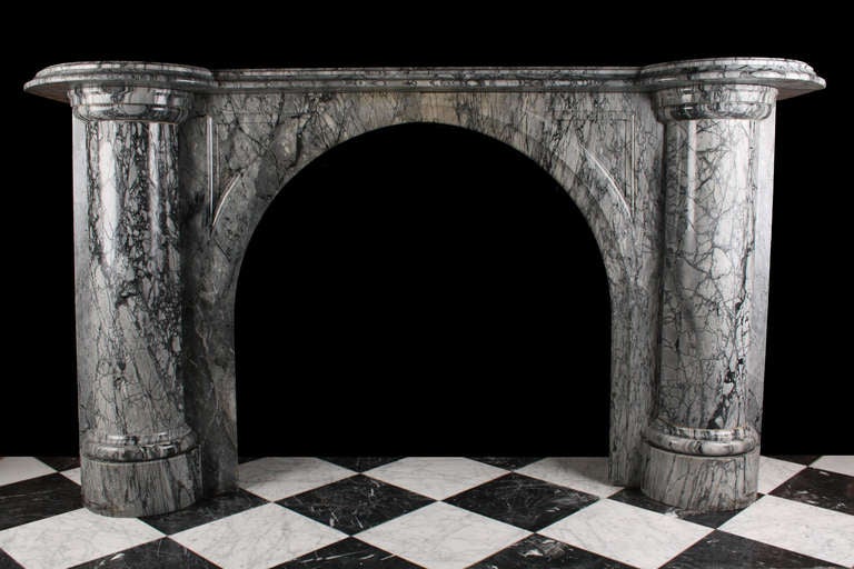 A Grand and Impressive Arched Victorian Mantelpiece, carved in Bardiglio Black veined Blue Grey Marble, English Mid 19th Century.

Depth: 17