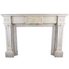 A Louis XVI Antique Fireplace Mantle in Carrara Marble