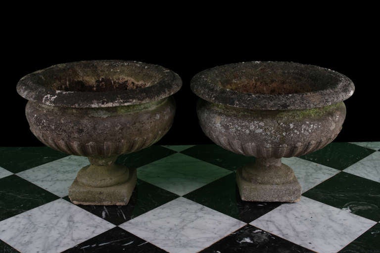 Matching pair of antique Victorian garden urns.  Hand crafted in stone.  Mid 19th century. More available.
The sizes are 18inch (46cm) high and 22inch (56cm) wide, for each.