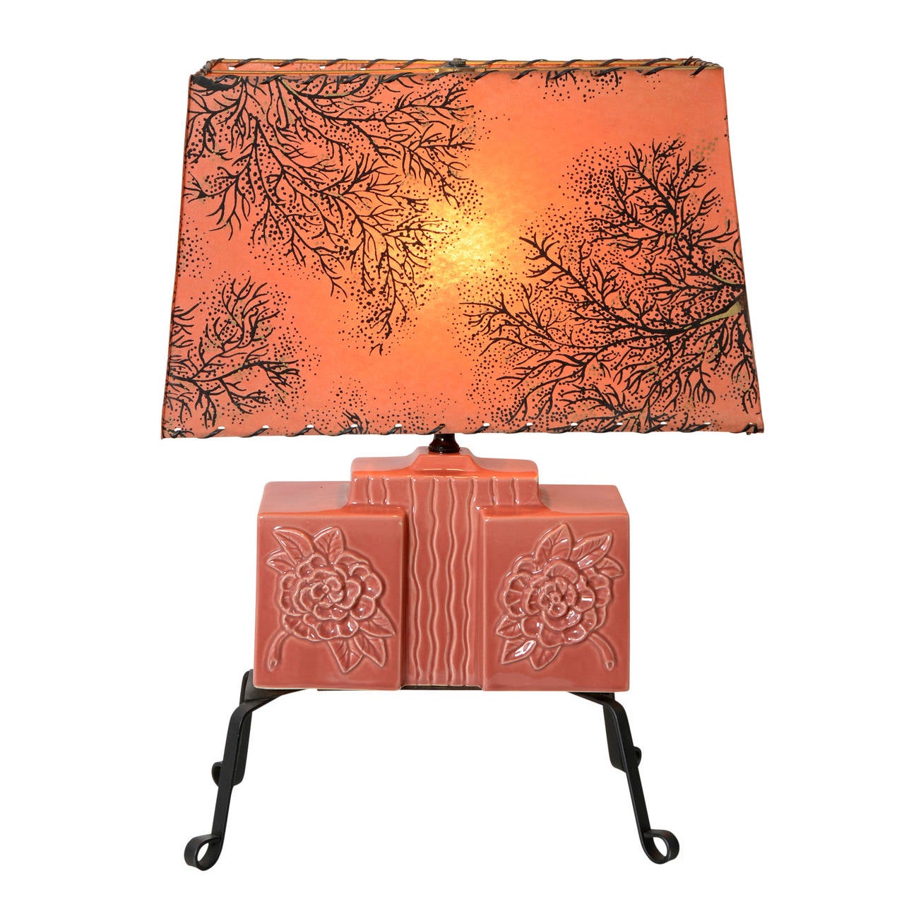 We are head-over-heels for this trio of rose-colored table lamps. The bodies are made from cast ceramic, featuring modern floral and organic patterns. The bases are wrought iron strapping, which, despite the material, give the lamps an airy,