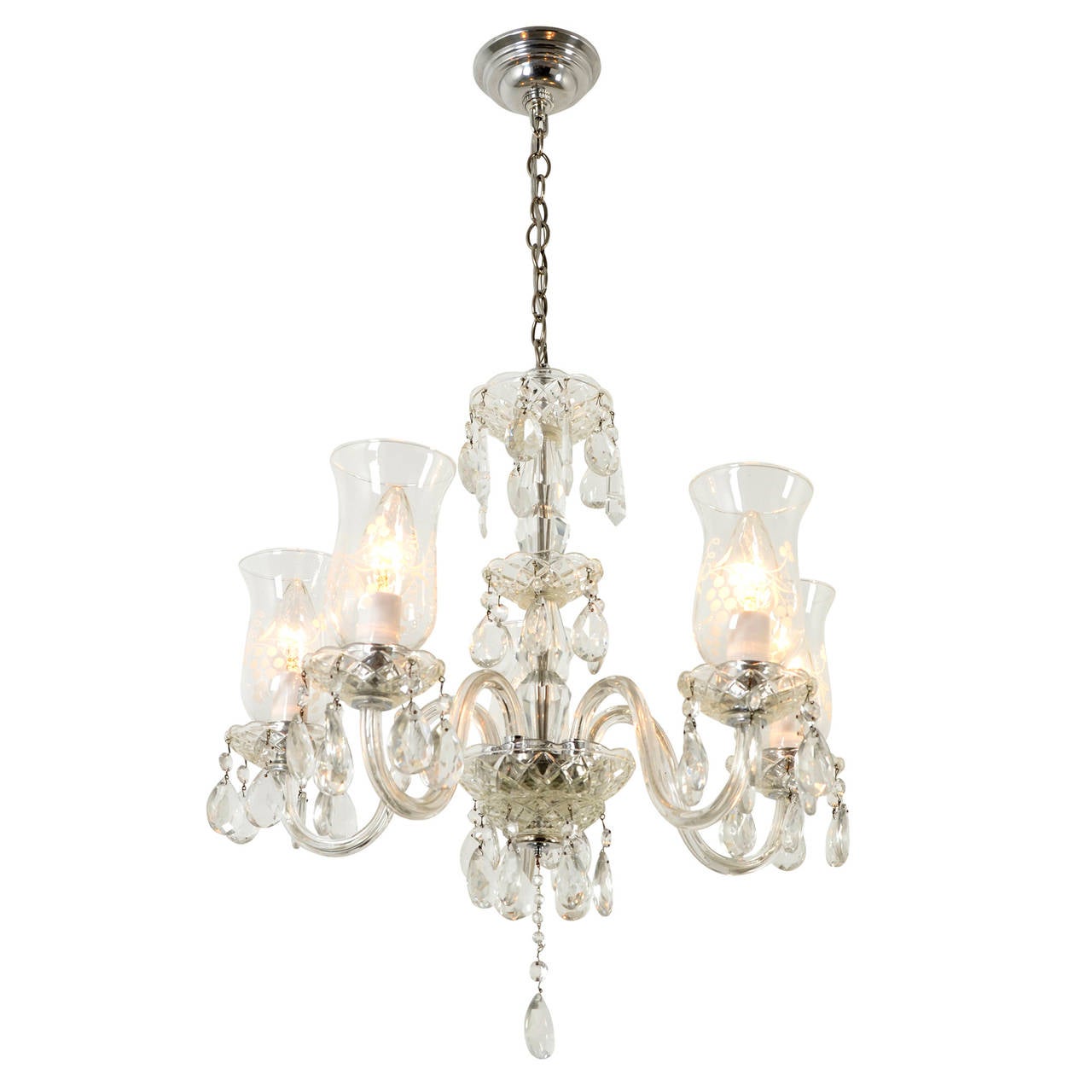 Although designed and produced for the Cape Cod and Colonial Revival homes that dotted the growing suburbs of America in the 1930's and '40's, this exuberant chandelier actually draws its roots to European glass lighting of the late 19th century.