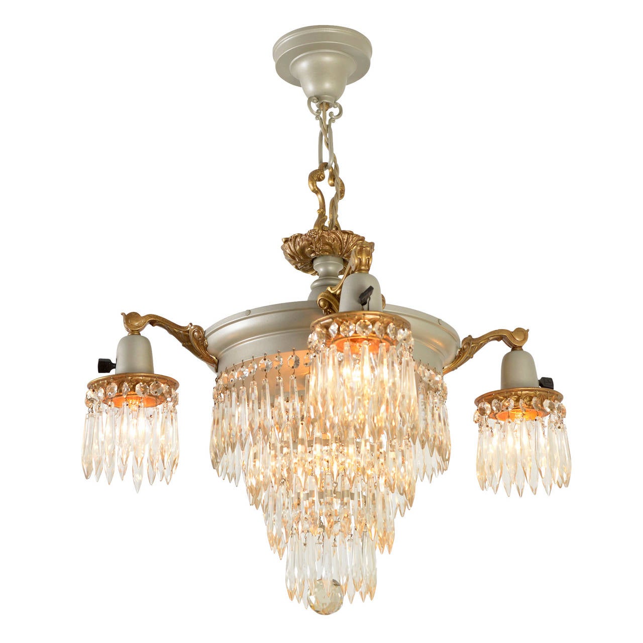 The definition of European elegance and sophistication in the early 20th century, large multi-tiered crystal chandeliers were considered eminently stylish and above reproach among those seeking to impress their friends and neighbors with their