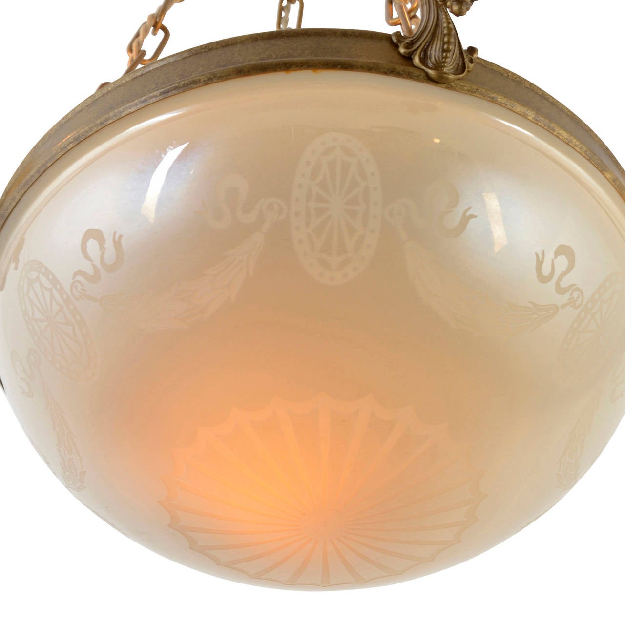 Steuben Glass Works proudly produced this awe-inspiring art glass bowl chandelier in the late 1910's and 1920's, calling upon the nation's taste for classically inspired architecture and decor. The design and ornamentation of the piece are fairly