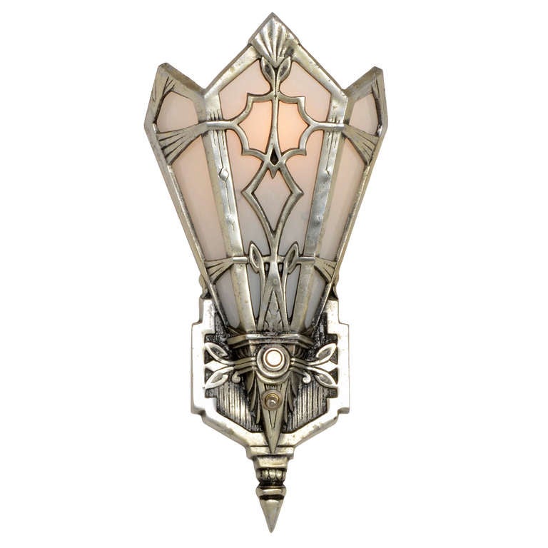 Outstanding examples of the boldly angular and forward-looking Modernistic lighting that we call Art Deco today (a term that wasn’t coined until the late 1960s), these cast aluminum sconces – sometimes called wall pockets in their day – feature