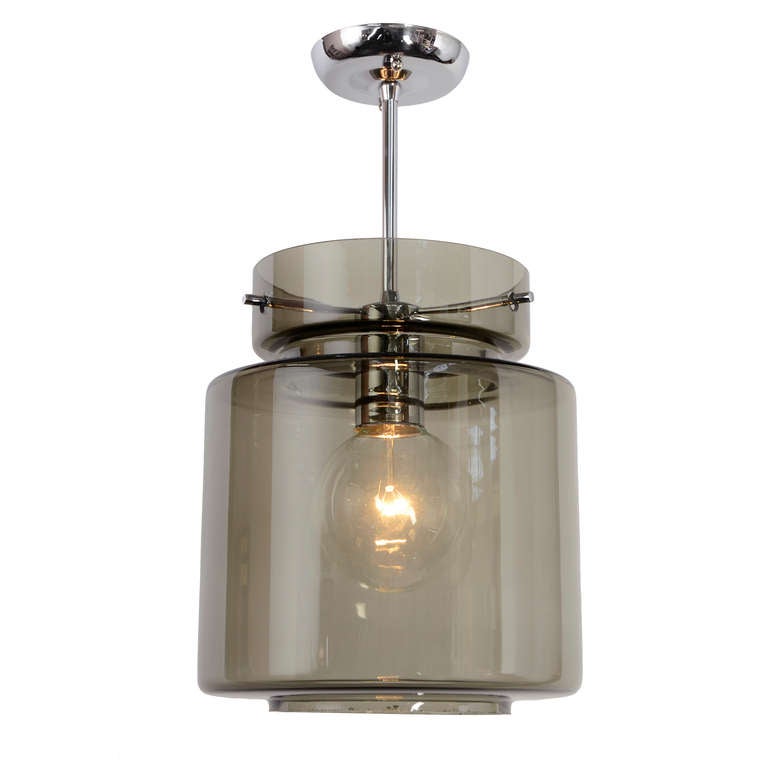 These two captivating contemporary pendants take some of the classic midcentury themes, like glass cylinders and tri-point shade suspension systems, and update them for the Disco Decade with sparkling large clear globe bulbs, a boundary-pushing
