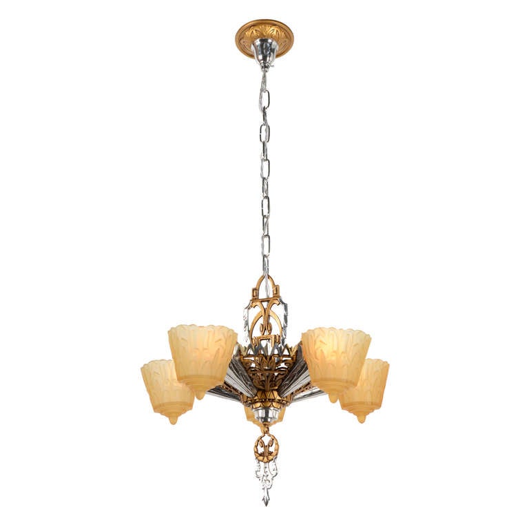 In the earlier days of Deco, chandeliers like this were the newest thing, establishing their own design language, free from influences of the past. Handpainted polychrome (a.k.a., multiple colors) finishes create the look of mixed metals – in this