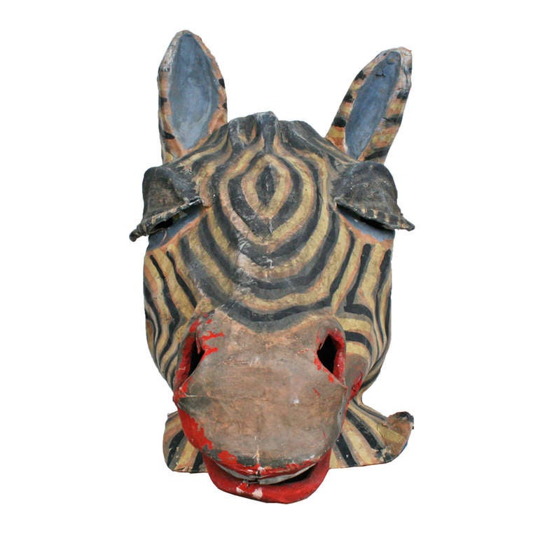 Lions and tigers and bears, oh my! This piece of amusement park history comes to us as part of a collection of 20 carnival mascot heads. Hand crafted from paper mache, leather and imagination, this Zebra is also comprised of nearly a century of