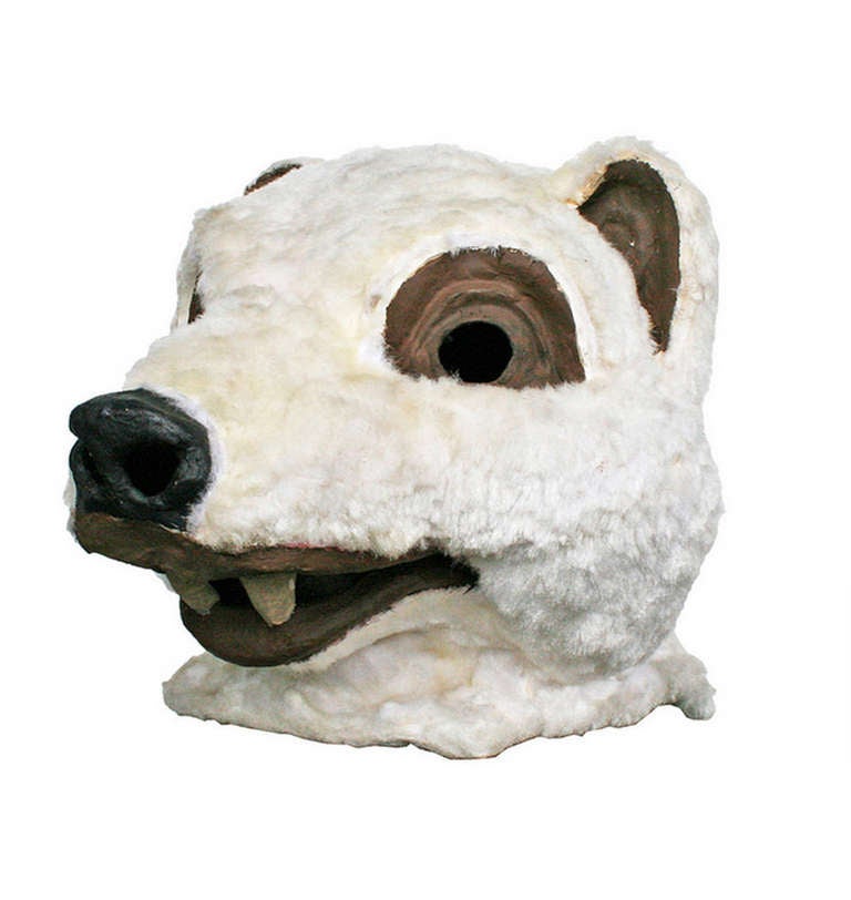 Lions and tigers and bears, oh my! This piece of playful history comes to us as part of a collection of 20 masks from an historic family costume shop. Hand made from paper mache, faux fur and imagination, this Polar Bear is also comprised of nearly