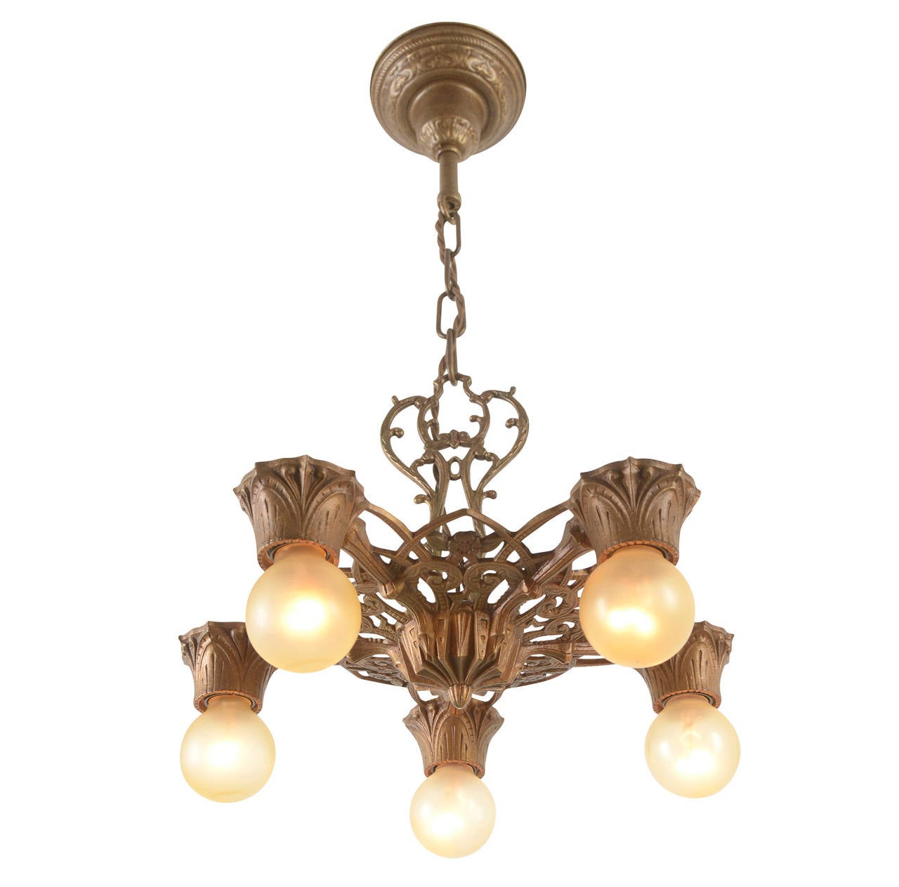 The late-1920s saw an explosion in the popularity of decorative cast white-metal fixtures with exposed globe bulbs and rich polychrome finishes like this example. Undeniably and unabashedly decorative, this fixture enhances its finely cast details