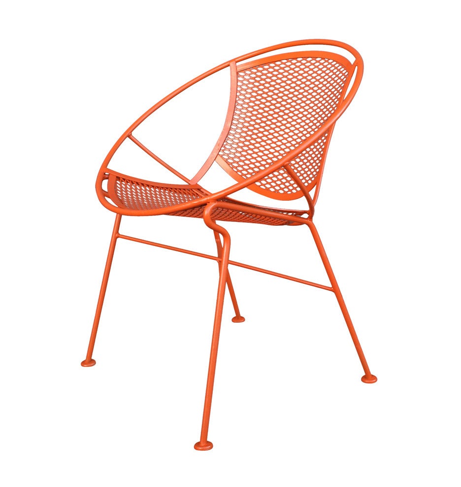 With summer on the horizon it's never too early to start thinking about updates for your backyard patio. This set of four hoop chairs, newly refinished in retro bright orange, would be the perfect addition to any outdoor space. Designed by Maurizio